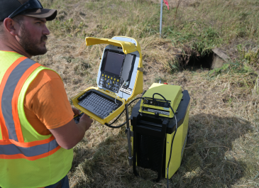 Pipe crawler tech checking out the structural integrity of a culvert.