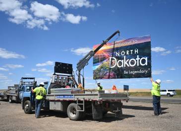 Installation of "Welcome to North Dakota" sign