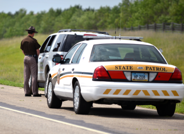 Highway Patrol pulling over vehicle on Interstate 94.