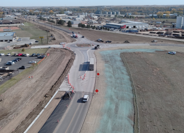Traffic moves through the new I-94 West Business Loop roundabout in Dickinson as crews continue finishing work along the corridor.