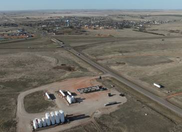 Aerial view of US 85 and I-94 junction area, showing open grassland, a I-94 intersection, and nearby infrastructure.