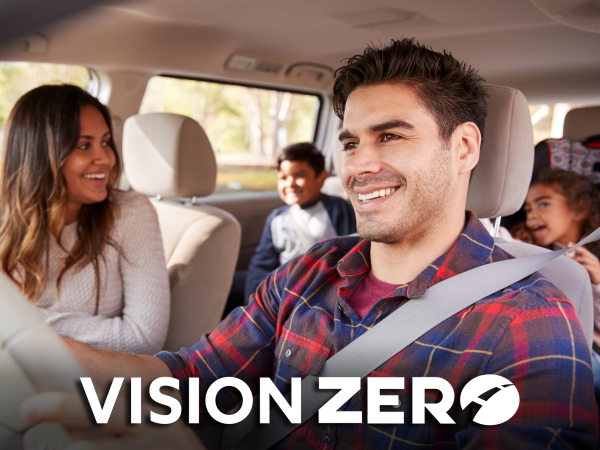 Happy family inside vehicle.