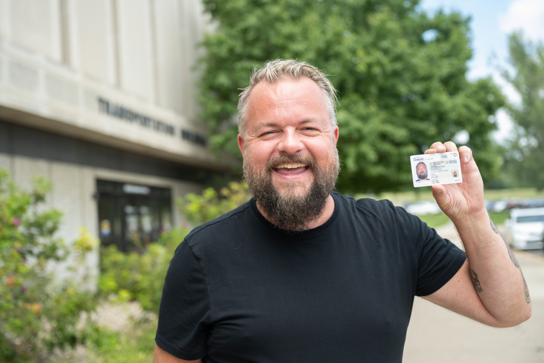 A North Dakota citizen stands outside of the NDDOT building after receiving his Real ID.