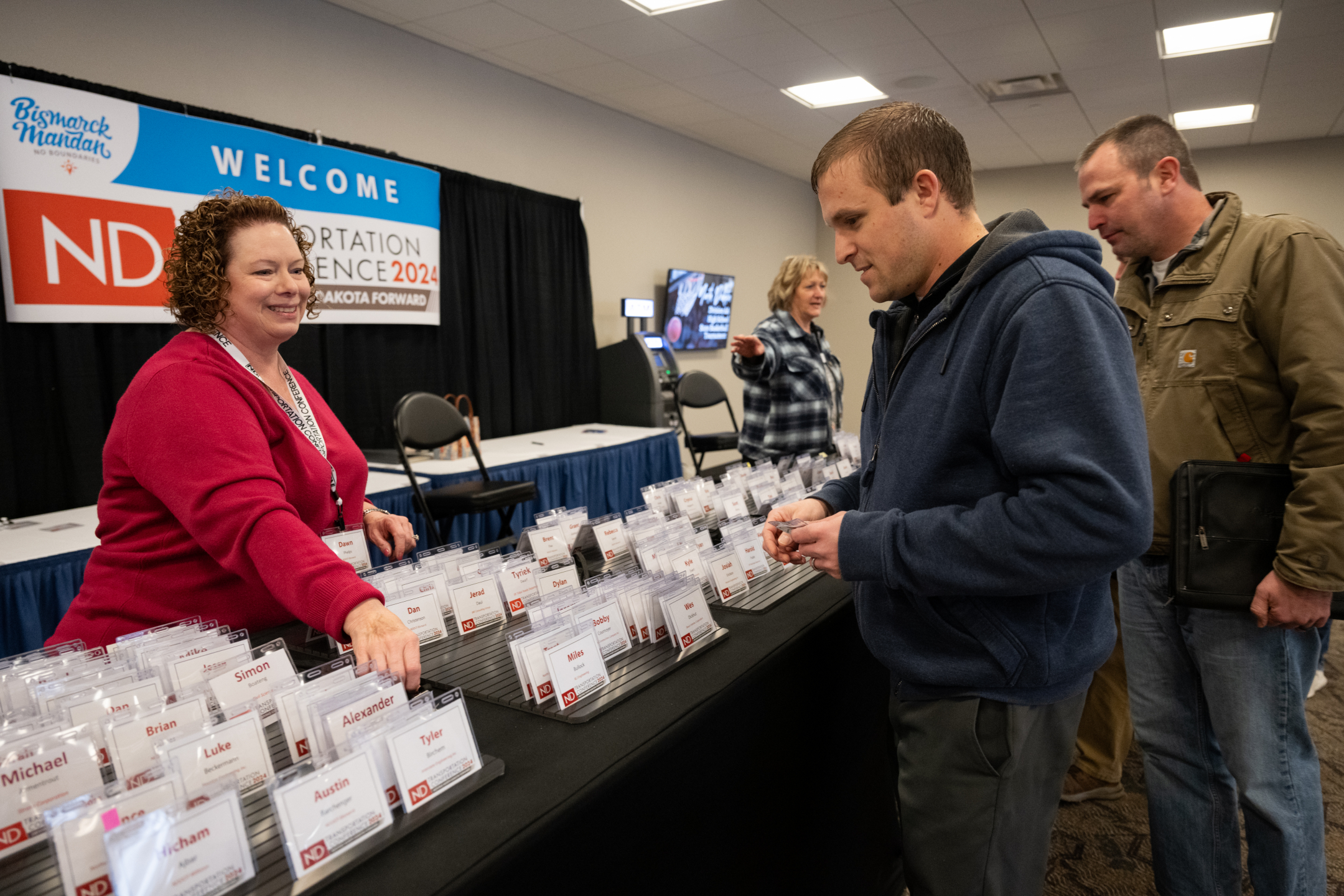 Picking up badges at the 2024 North Dakota Transportation Conference