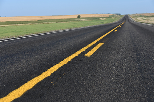 Low laying image of empty road.