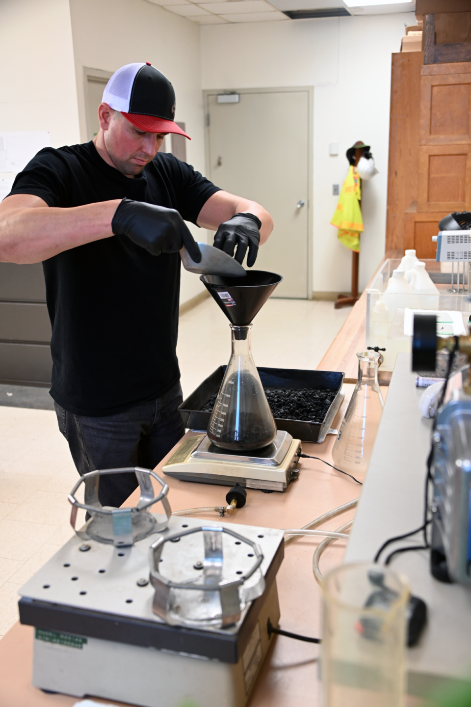 Materials and Research testing asphalt and aggregate in the lab.