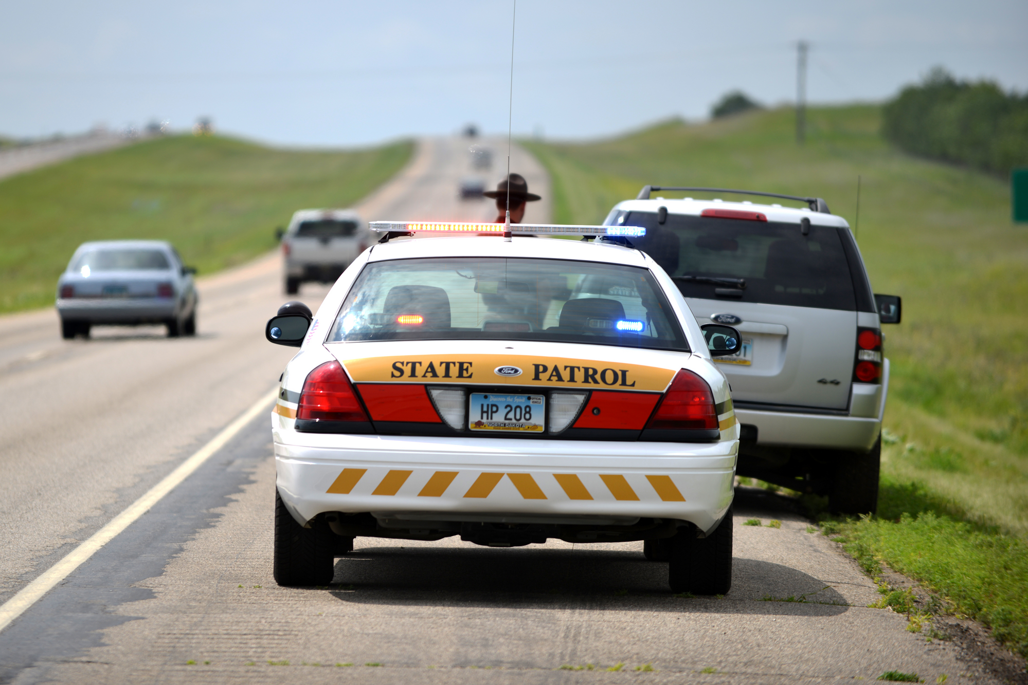 Highway patrol pulling over an SUV on Interstate 94.