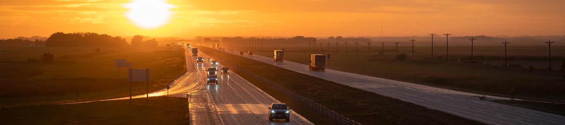 North Dakota sunset with traffic on Interstate 94.