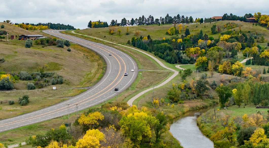 Road with cars in scenic North Dakota.