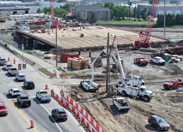 June '25 New bridge construction, temporary pedestrian walkway facing southwest