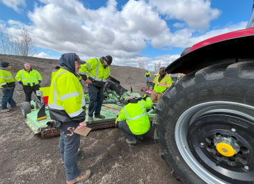 Inspecting a tow mower
