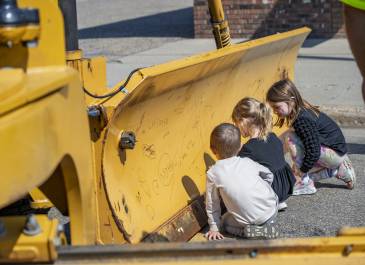 Kids sign the plow in Hazen