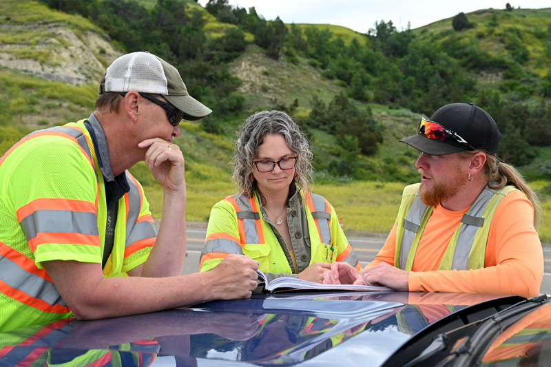 Consultant engineer discusses project with NDDOT team.