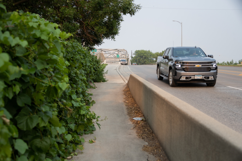 Vehicles coming over a bridge