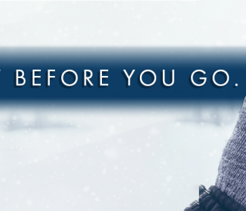 Hand holding mobile phone viewing the ND Roads app.